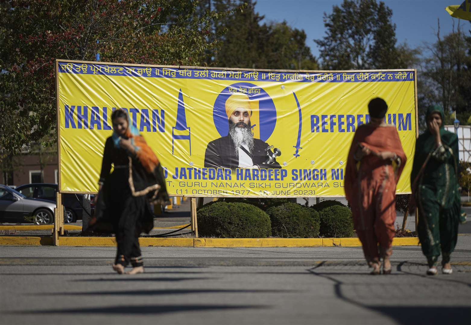 A photograph of Hardeep Singh Nijjar is seen on a banner outside the Guru Nanak Sikh Gurdwara Sahib in Surrey, British Columbia (Darryl Dyck/The Canadian Press/AP)