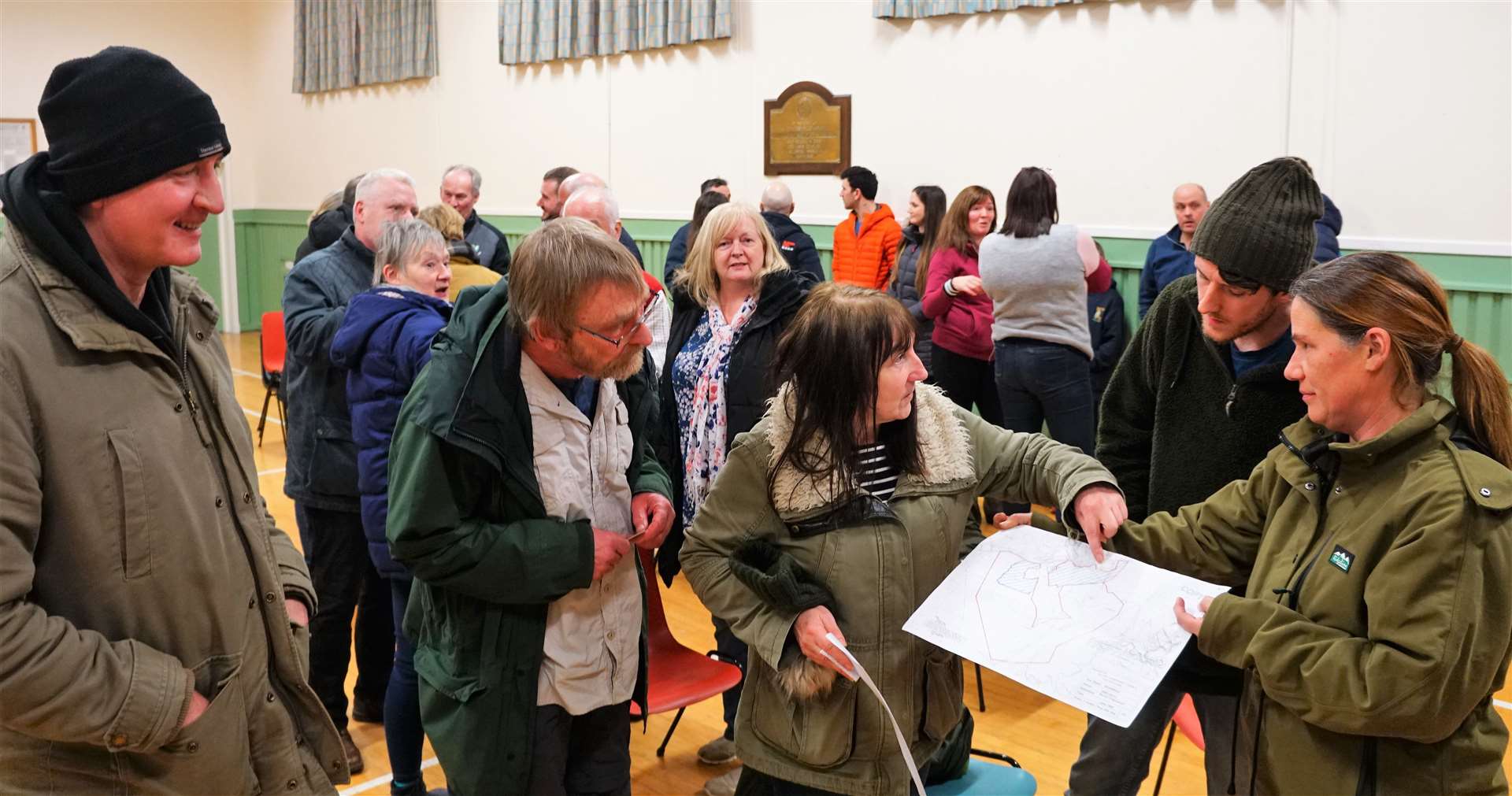 Members of the public survey the plans of the proposed wind farm development at a meeting in January. Picture: DGS