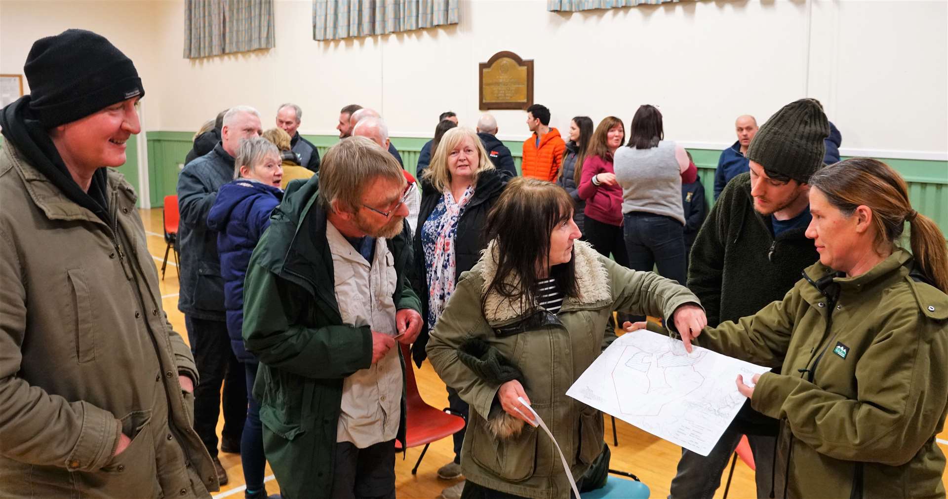Members of the public survey the plans of the proposed wind farm development at a meeting in January. Picture: DGS