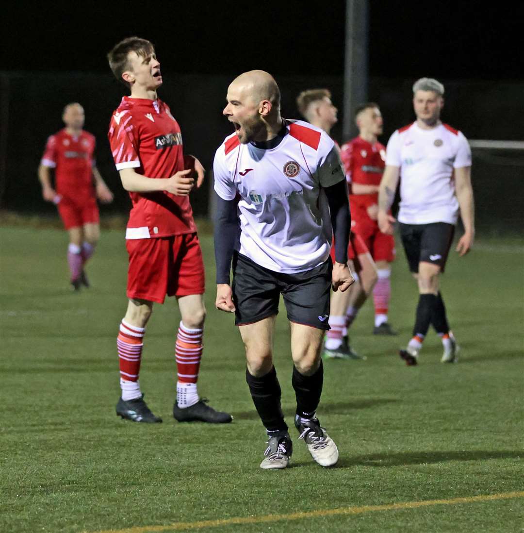 Halkirk United's Sean Munro turns away to celebrate after scoring against Thurso. Picture: James Gunn