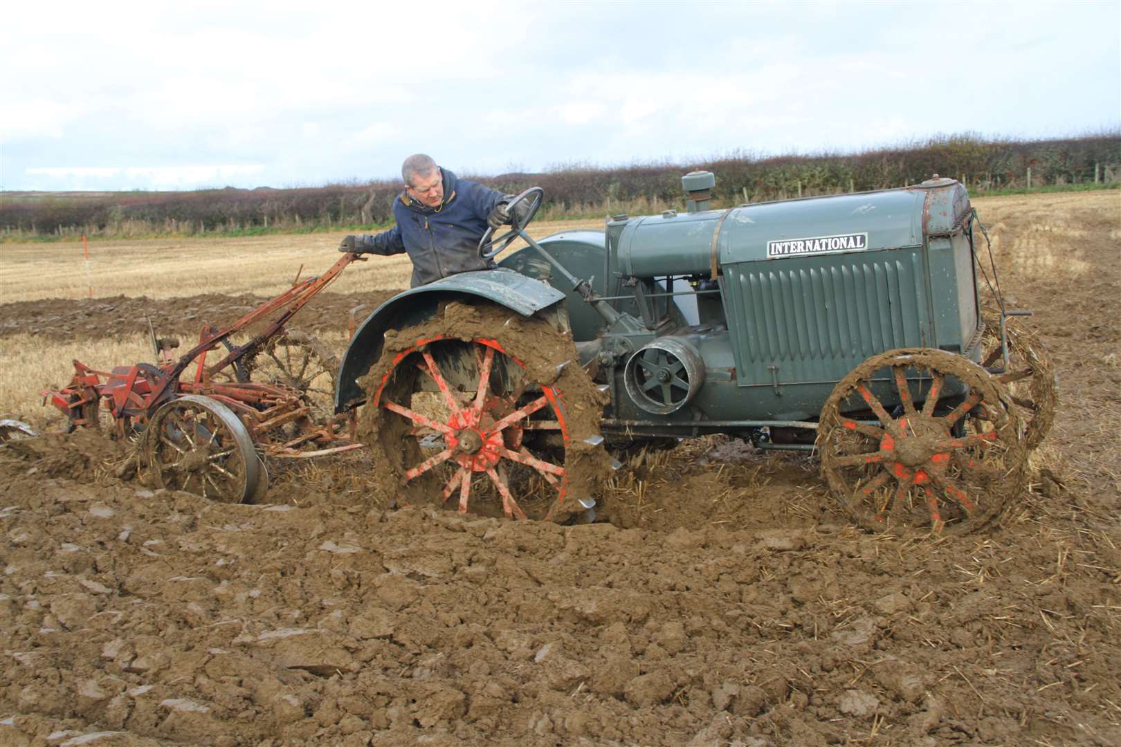 Michael Mackay, West Greenland, on his way to claiming the overall winner prize at Watten Mains. He was driving an impressive 90-year-old International with an International vintage training plough. Pictures: Willie Mackay