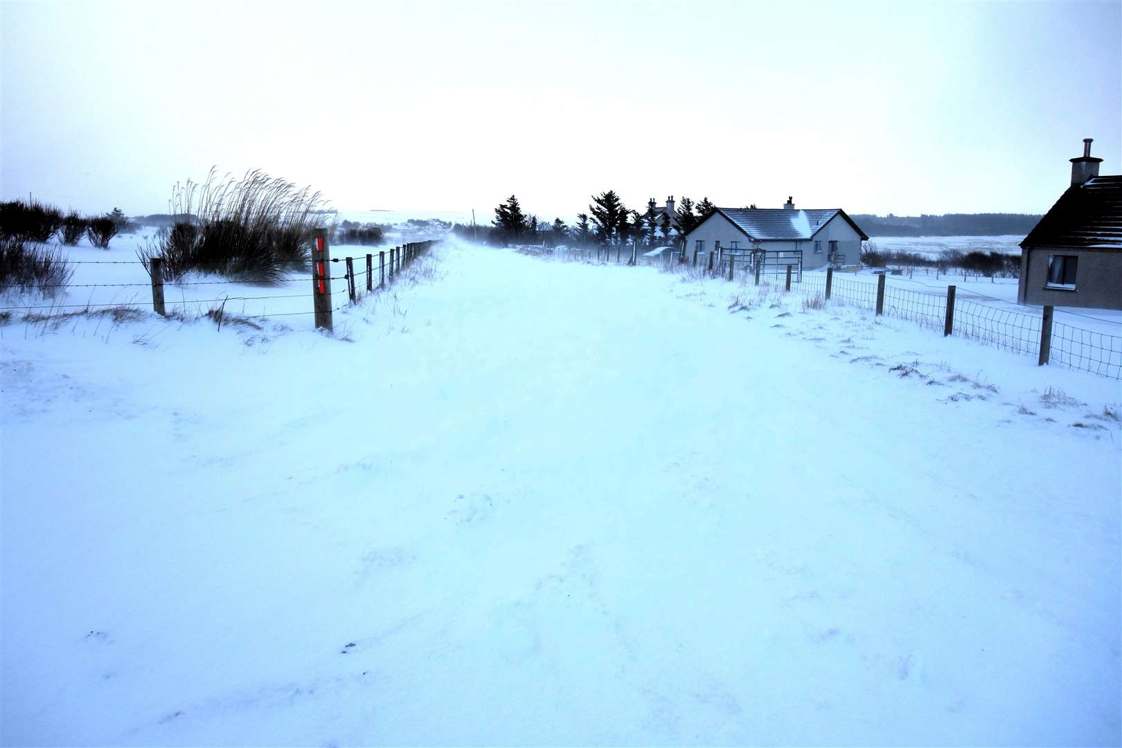Malcolm Clark took pictures outside his home near Dunnet to show how deep the snow is.