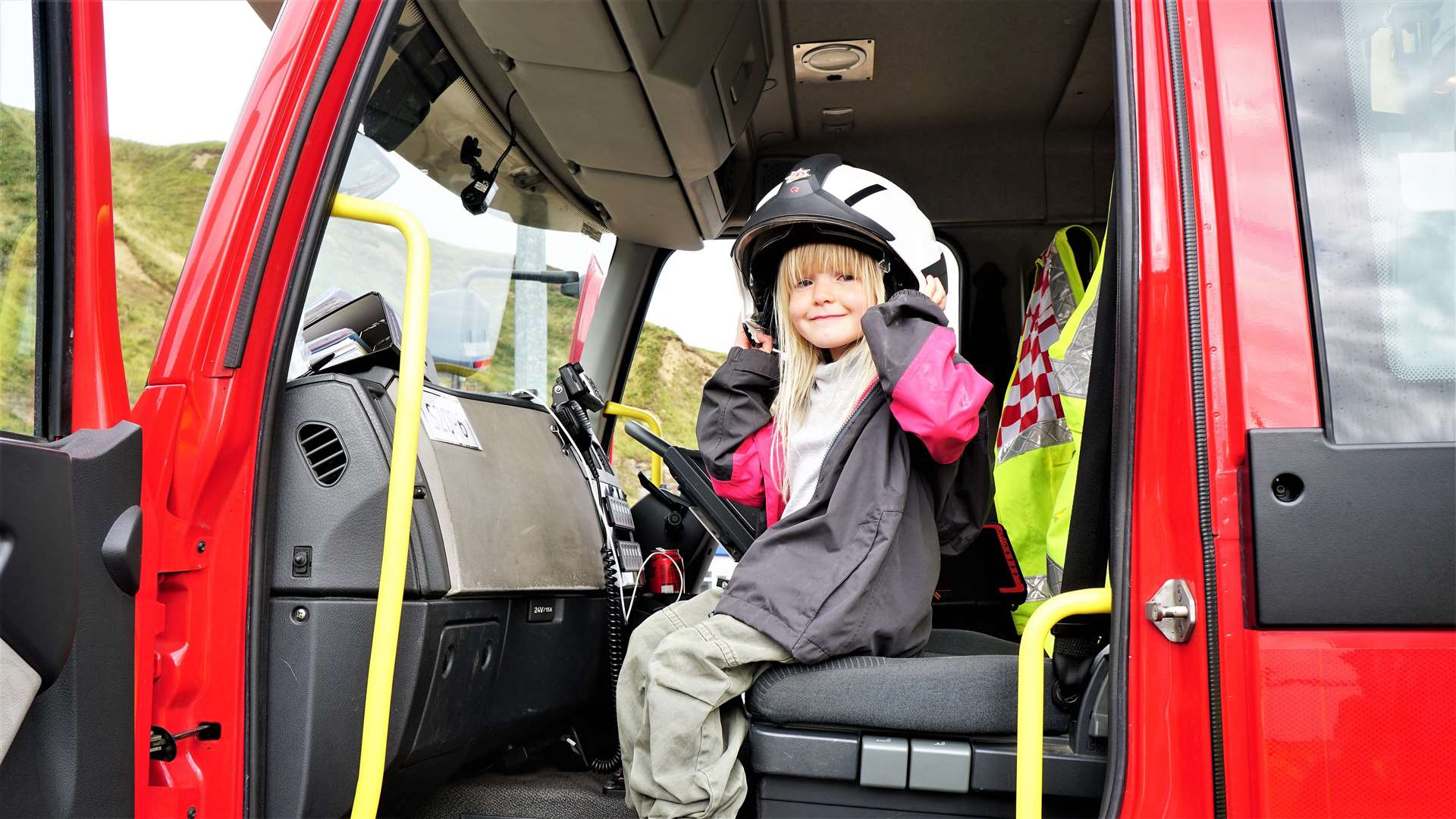 Young Charlotte was one of many children delighted to get on board the fire engine. Picture: DGS