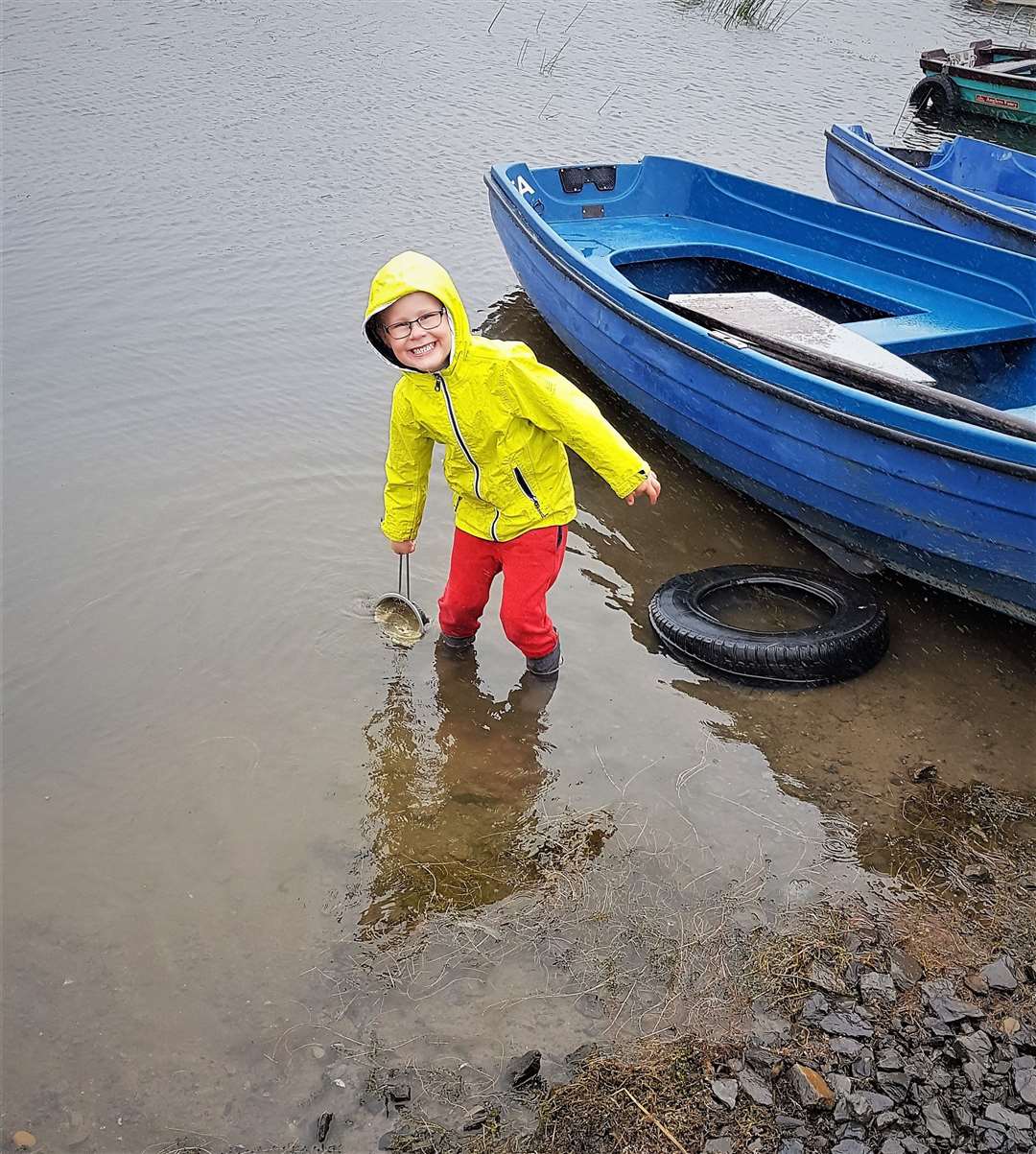 Jordan 'panning for gold' in St John’s Loch, Dunnet. His mother says he loves the water. Picture: Estie Broughton