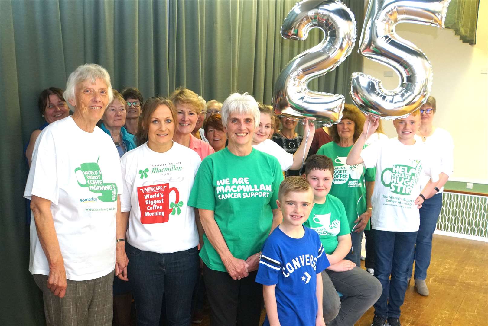 The Macmillan coffee morning volunteers celebrated 25 years of fundraising which has seen over £50,000 raised towards the charity. Dianne Mackay is pictured in the middle wearing the green top. Pictures: DGS