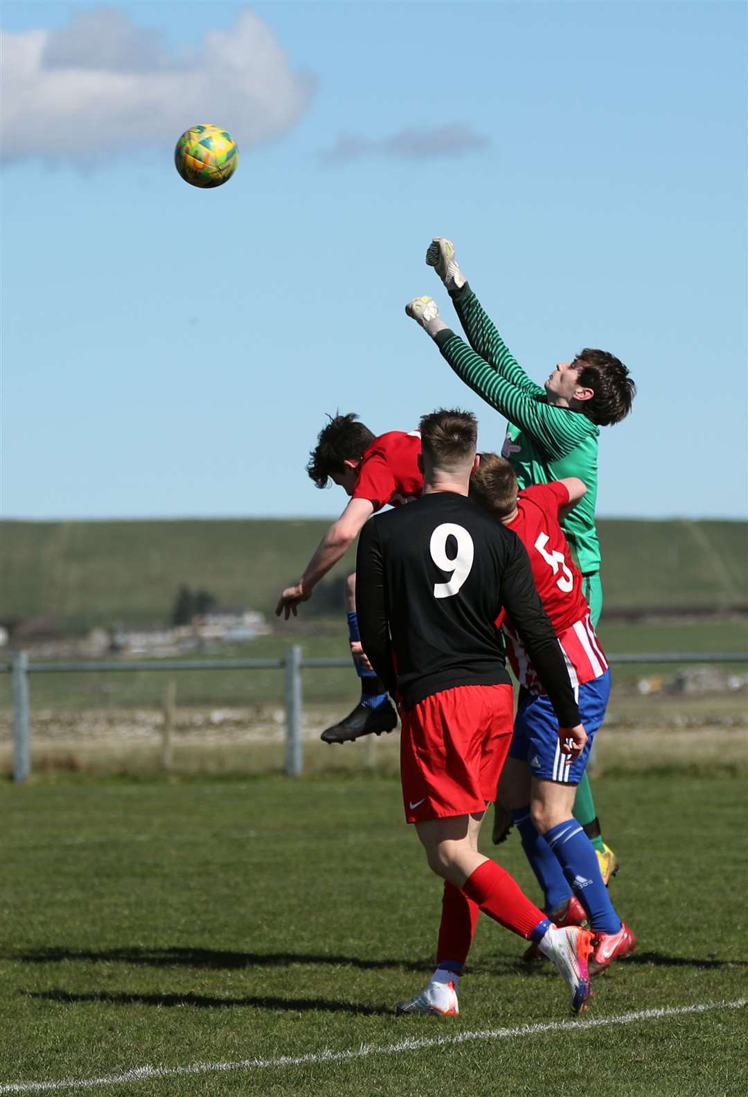 Halkirk United goalie Kieran Macleod punches clear. Picture: James Gunn