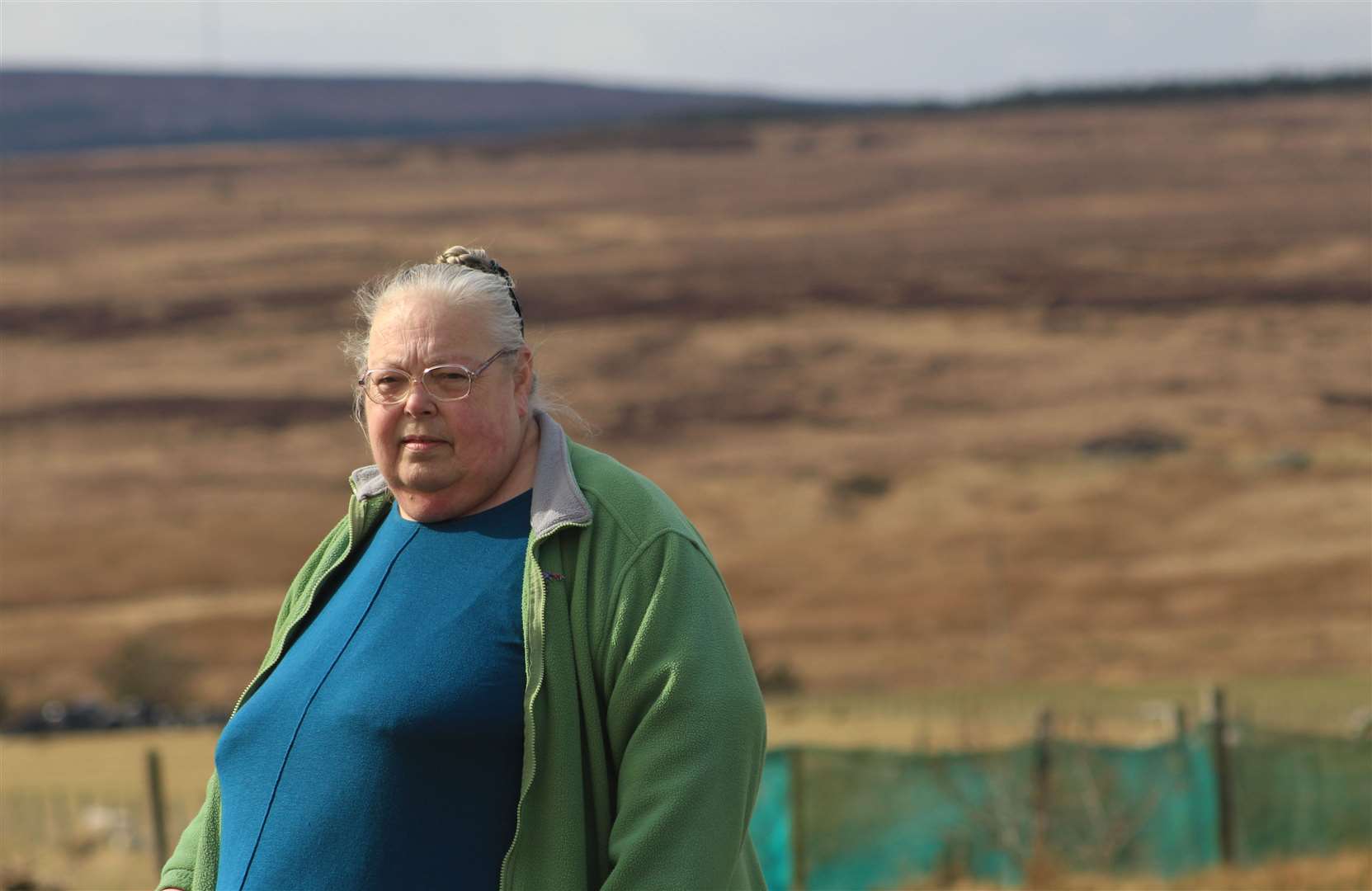 Jo Bowd outside her home at Roster. She says she fears being surrounded by turbines following the Scottish Government ministers' approval for Golticlay Wind Farm. Picture: Alan Hendry
