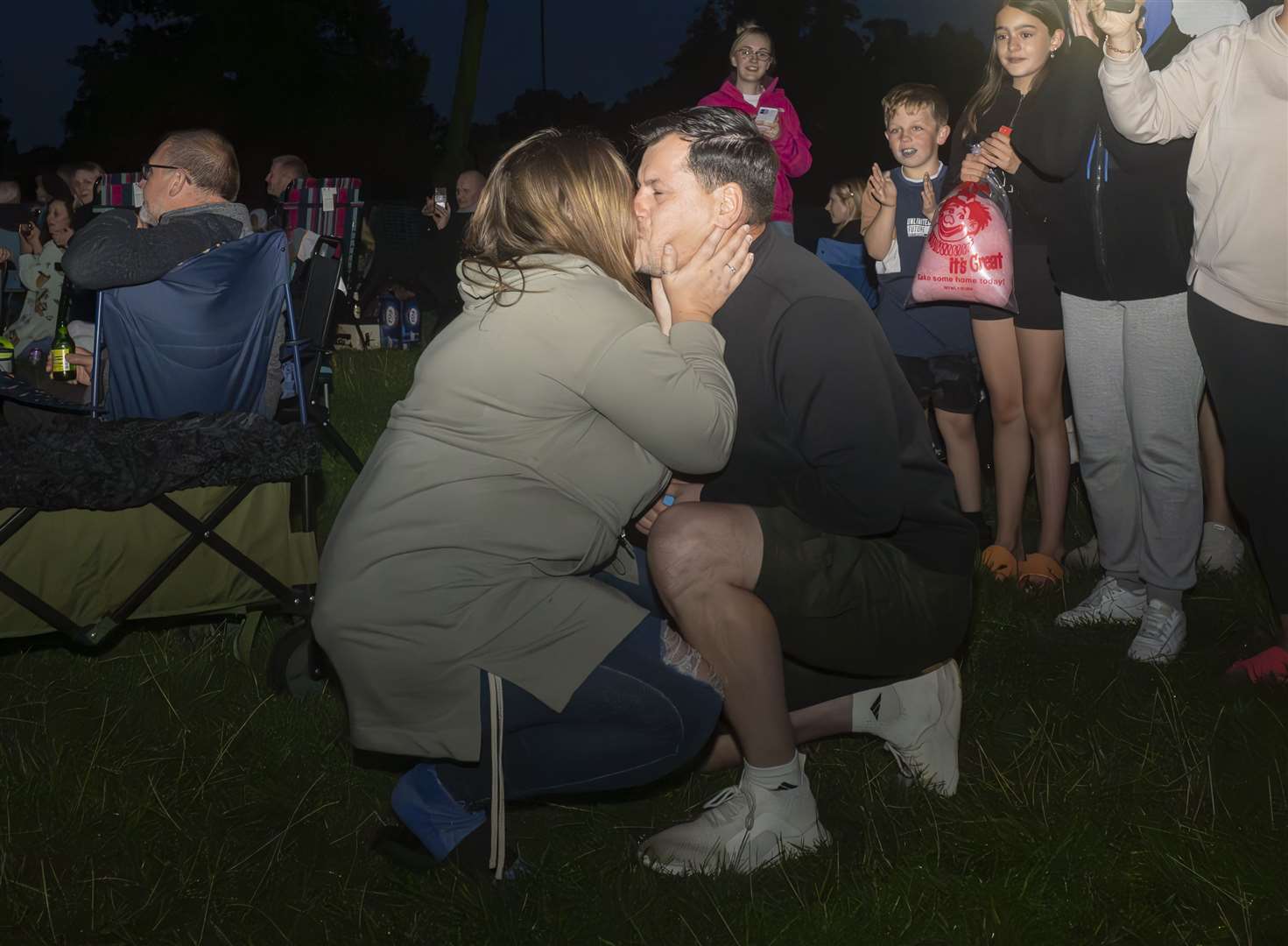 Rhys Whelan and Megan Greenwood share a kiss following his surprise proposal during the Fireworks Championships (Danny Lawson/PA)
