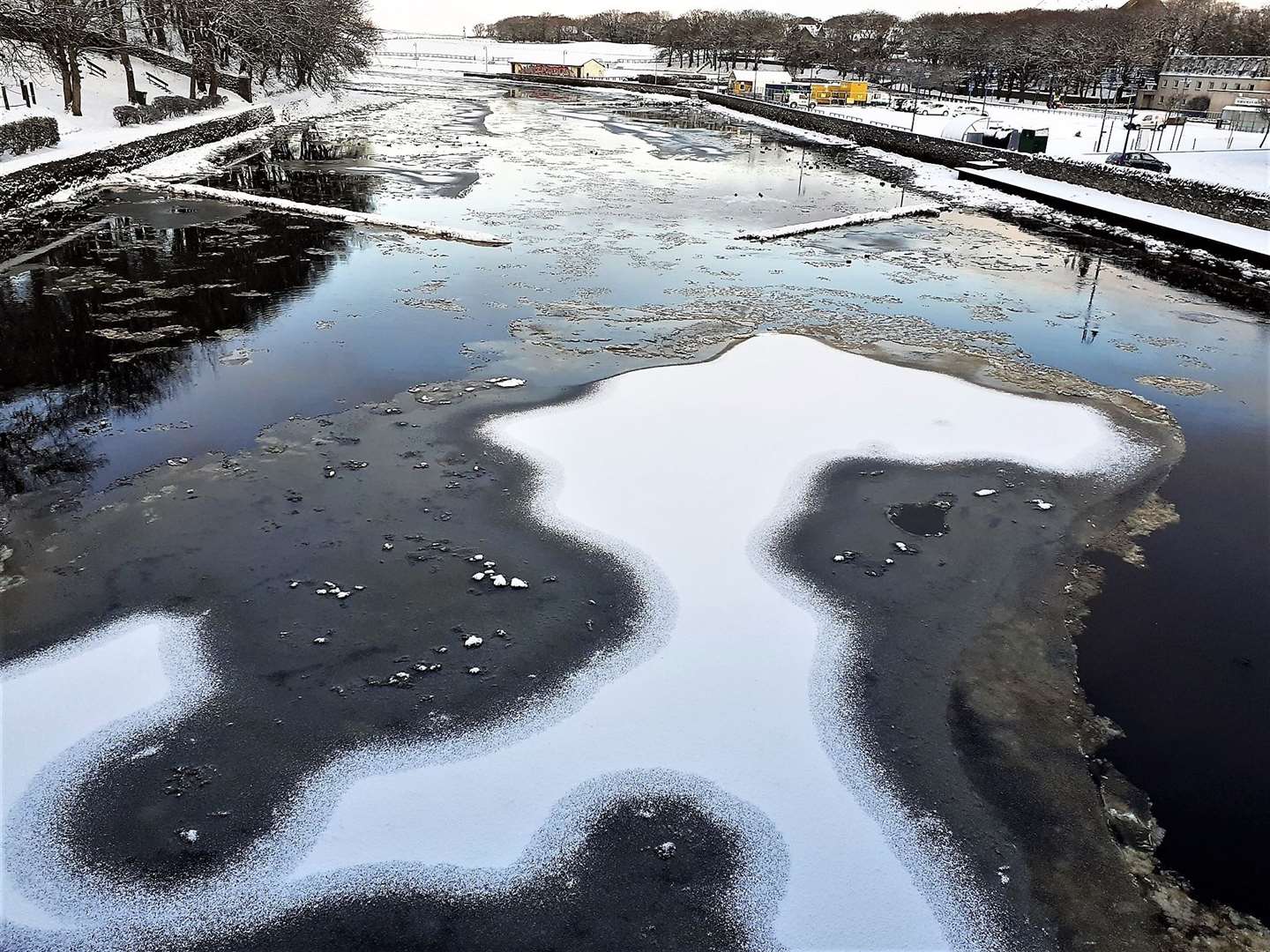 The strange shape photographed at Wick river during the freezing days earlier in the week, resembled a figure. But who or what? Picture: Derek Bremner