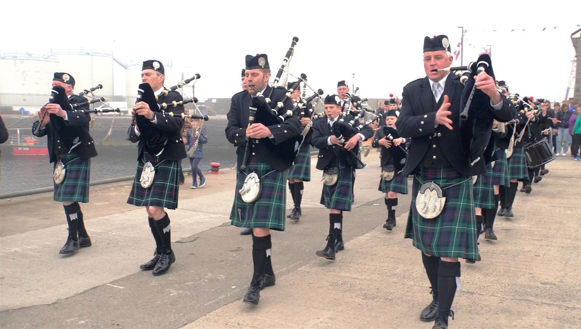 Wick RBLS Pipe Band at the recent Lifeboat Day event at the town's harbour.