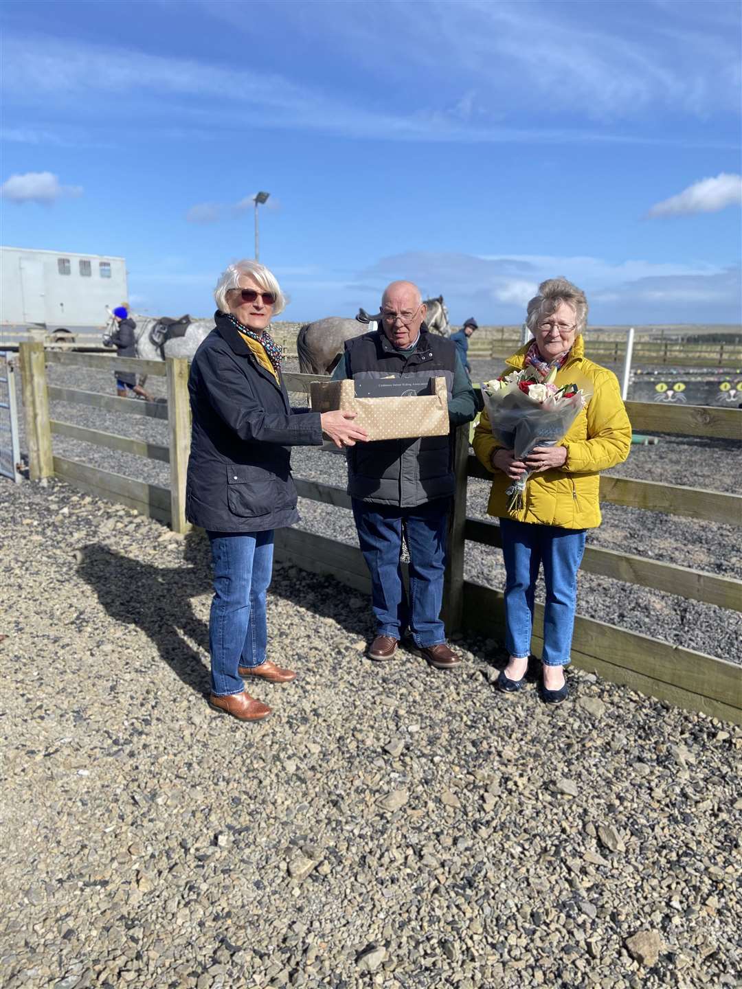 Caithness Indoor School Association treasurer Dorothy Henderson presented Mr Christie Cameron with a slate clock and a meal voucher on the occasion of his retirement, while his wife Isobel Cameron (right) received flowers.