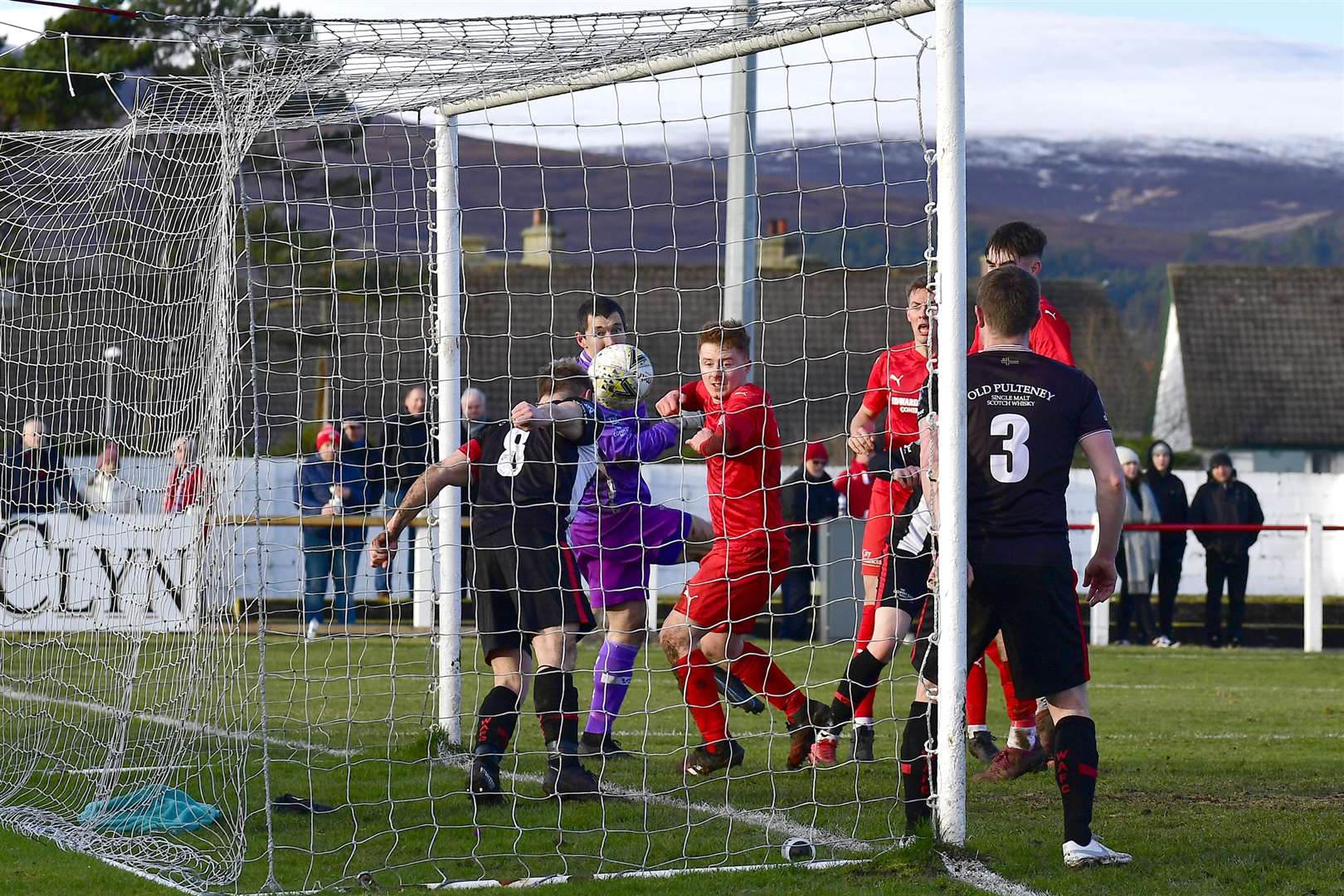 Wick Academy's Jack Halliday appears to nod the ball off the line after a header from Brora's Martin Maclean – but a goal was given. Picture: Mel Roger