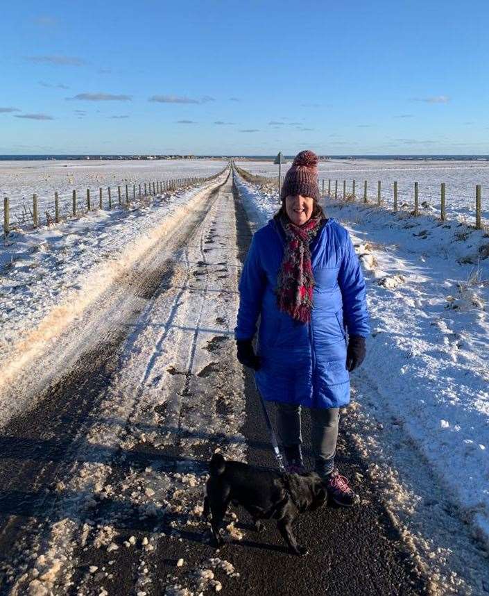 Pat Ramsay out for a walk on the Noss road on Wednesday with Percy the pug, who is owned by her daughter Hannah Bowers.