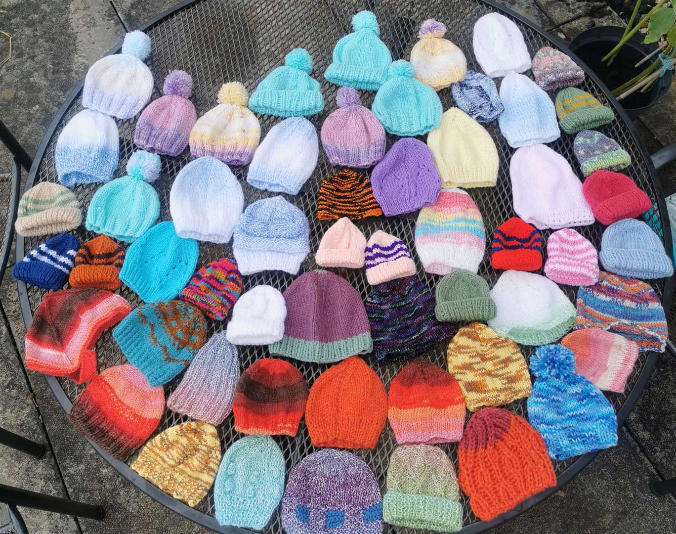 Hats knitted by John and his students for community midwives in Golspie during lockdown.