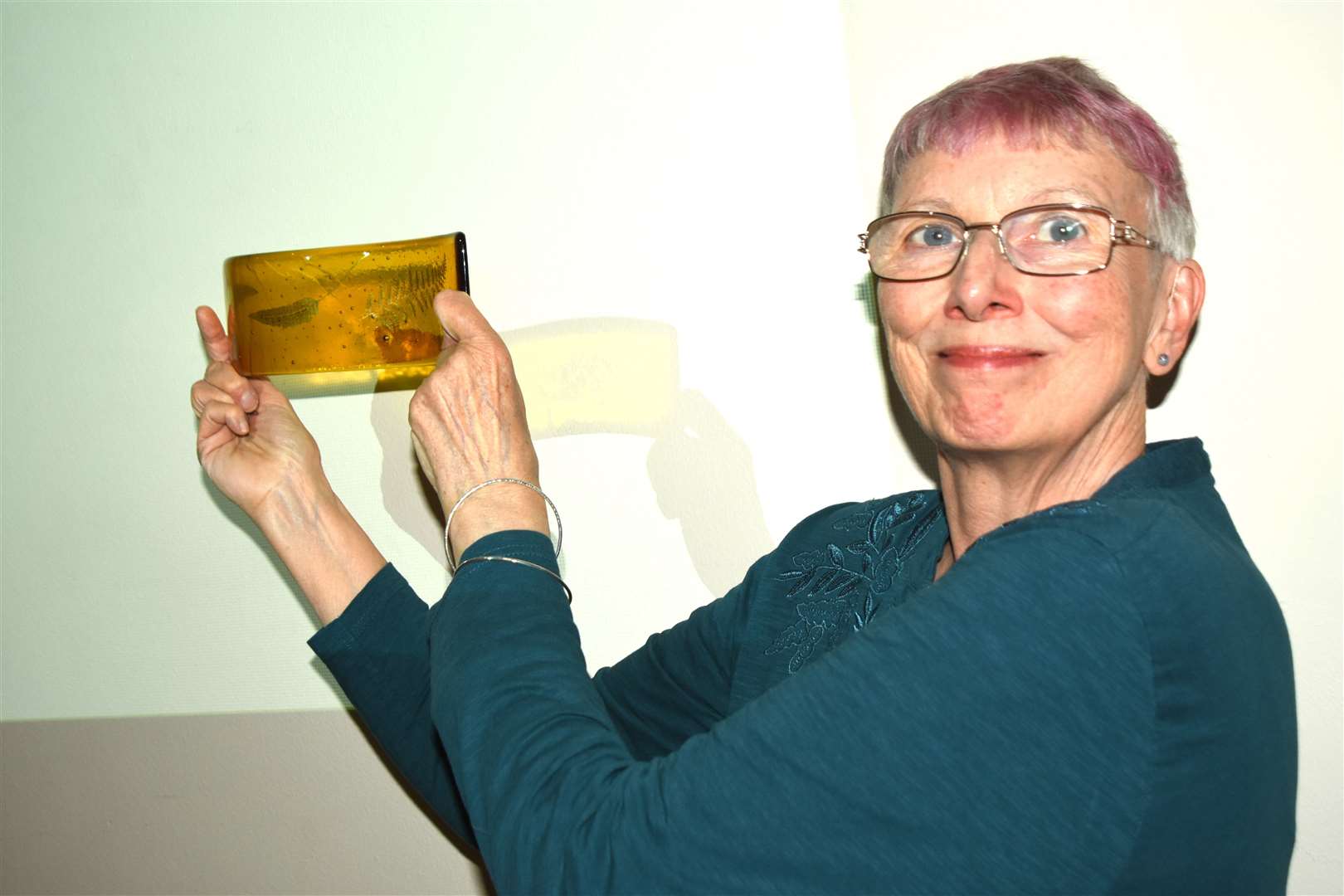 Anne Ross with one of her glass pieces
