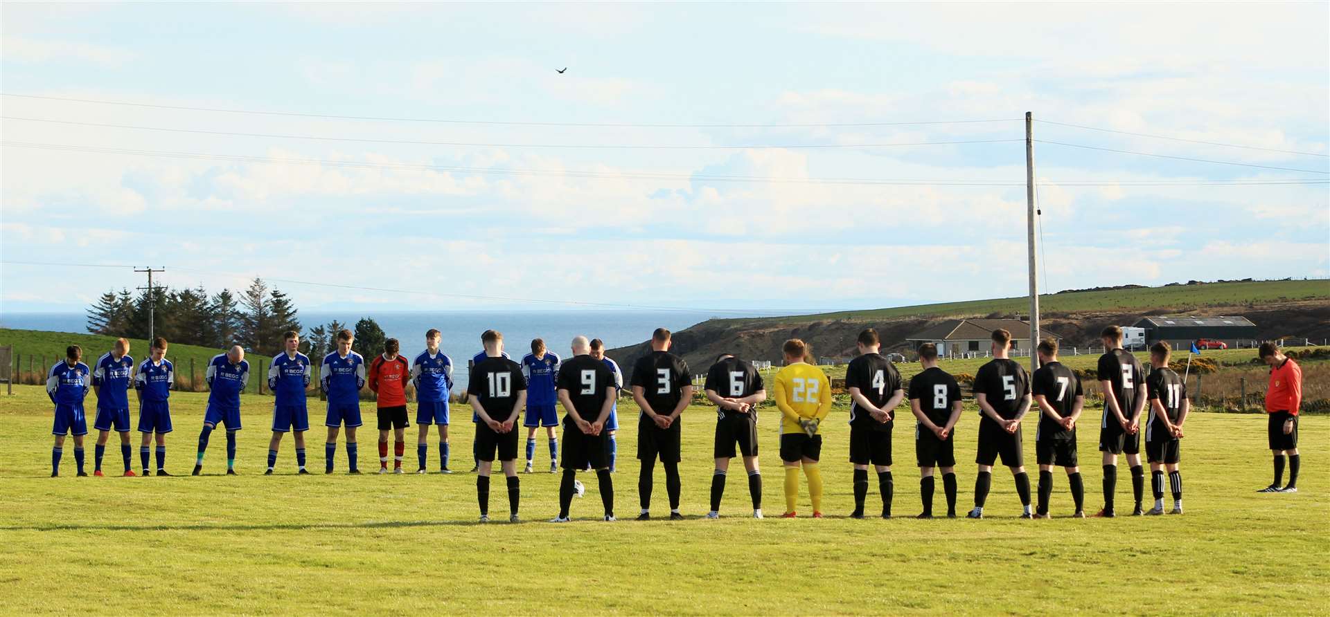 Lybster and Keiss players observing a minute's silence in memory of Craig Banks before the match at Cow Park marking the start of the 2023 CAFA second division campaign for both clubs. Picture: Alan Hendry