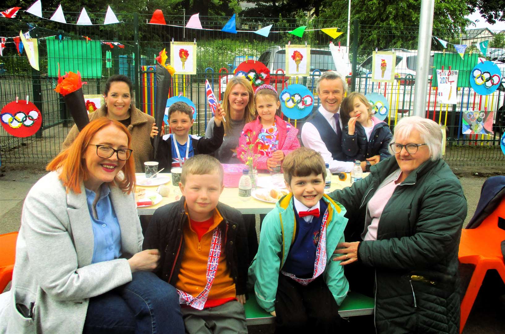Families enjoy their playground picnic.