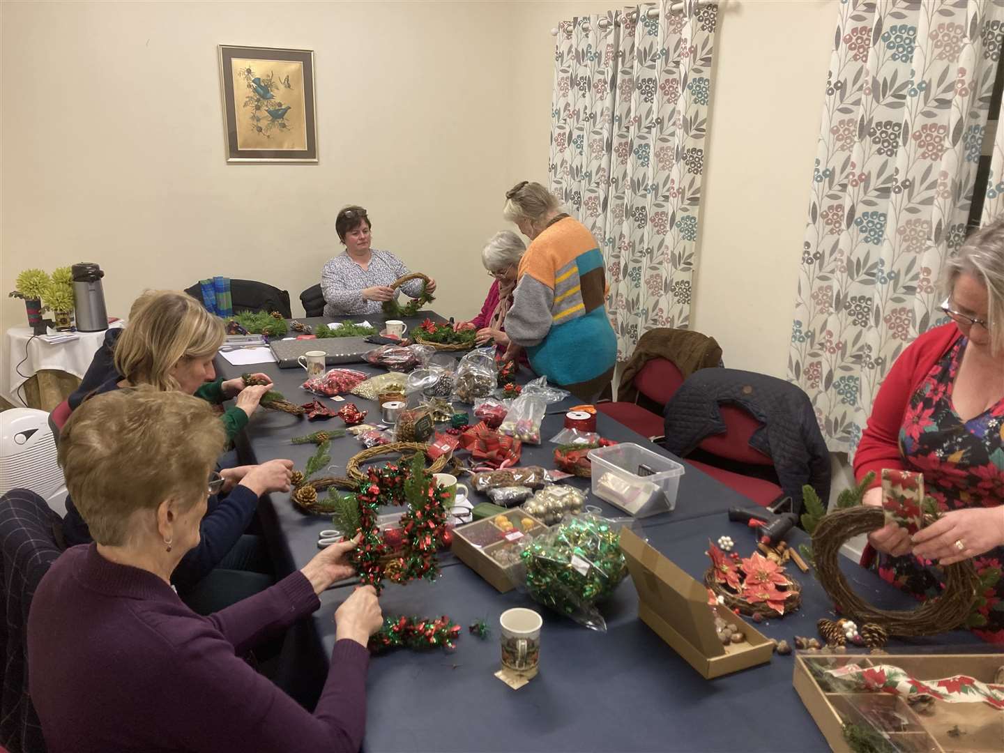 Spittal SWI members busy making Christmas wreaths at their December meeting.