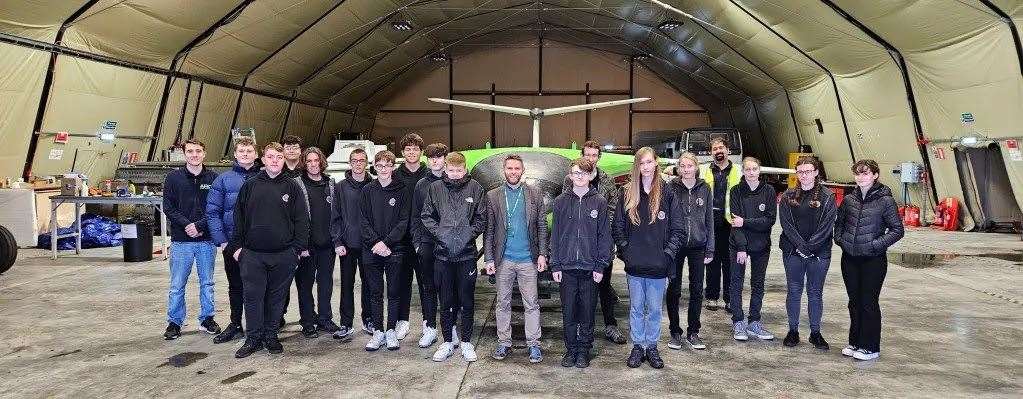 Computer science teacher Chris Aitken with Wick High School pupils who had the chance to see a state of the art drone at the local airport. Pictures: WHS