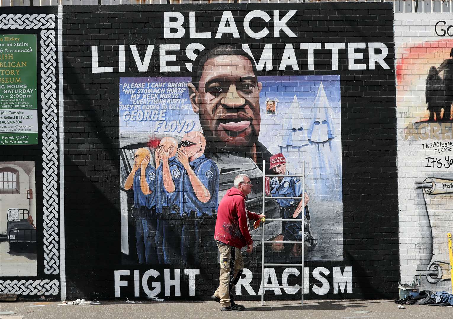 Artist Micky Doc puts the finishing touches to a mural of George Floyd at Belfast’s International Wall on the Falls Road in June. Mr Floyd was killed on May 25 while in police custody in the US city of Minneapolis (Brian Lawless/PA)