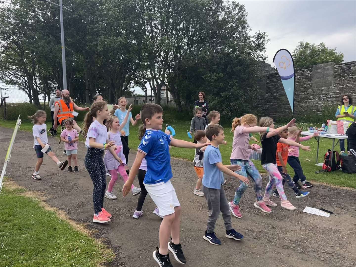 Children warm up at last week's junior parkrun at Millbank Boating Pond in Thurso.