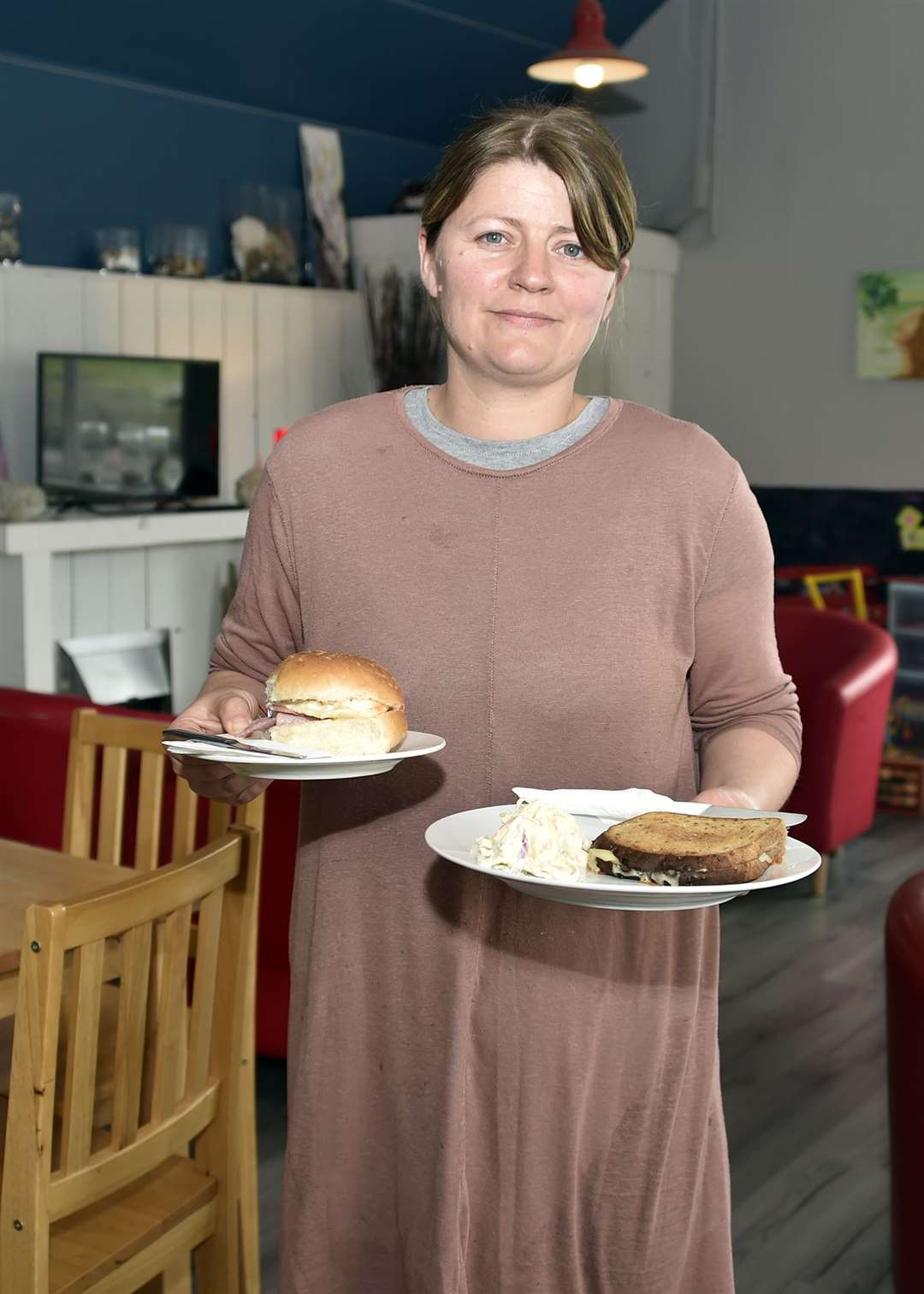 At your service: Ann Brock delivers a bacon roll and a toastie at Thurso Community Café.
