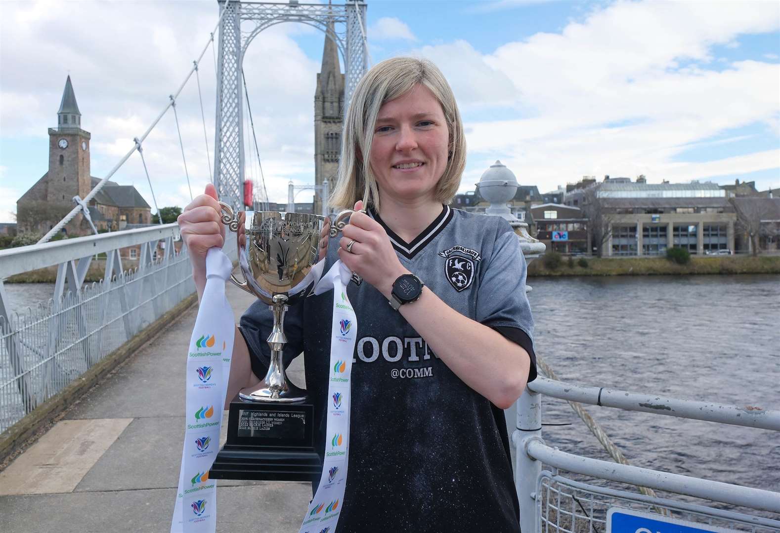 Caithness player Carly Erridge with the Highlands and Islands League trophy at the season's launch event in Inverness. Picture: Aimee Todd / Sportpix
