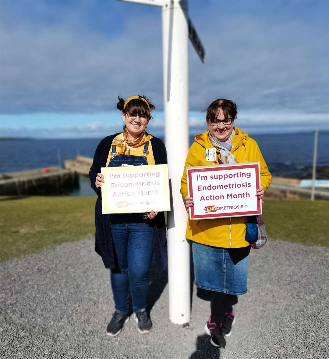 Rebecca (left) and Kirsteen helping to raise awareness of endometriosis at John O'Groats.