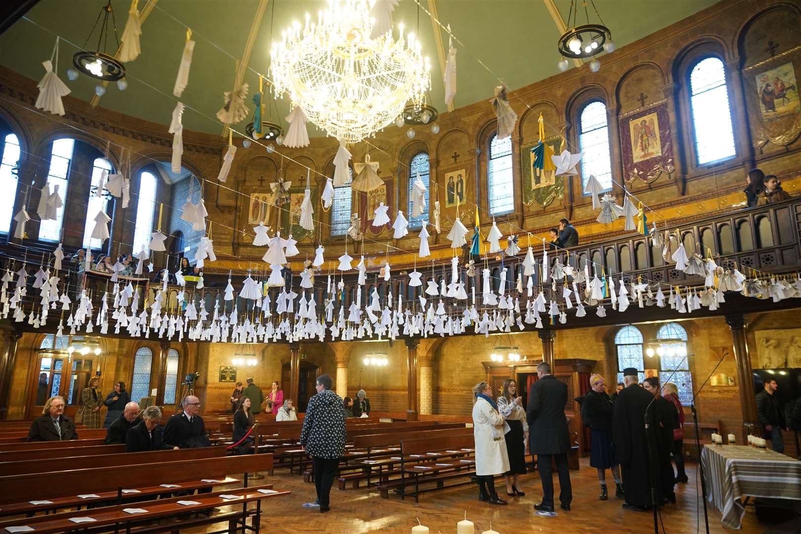 Some 461 paper angels, one for each child that has died in the past year according to official statistics, hang from the roof of the Ukrainian Catholic Cathedral in London (Yui Mok/PA)