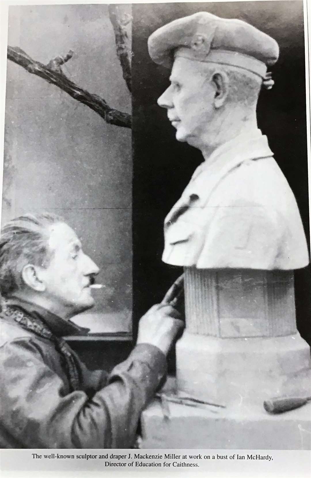 Sculptor J Mackenzie Miller, who had a drapery shop on Bridge Street in Wick, working on the statue of Col Ian McHardy.