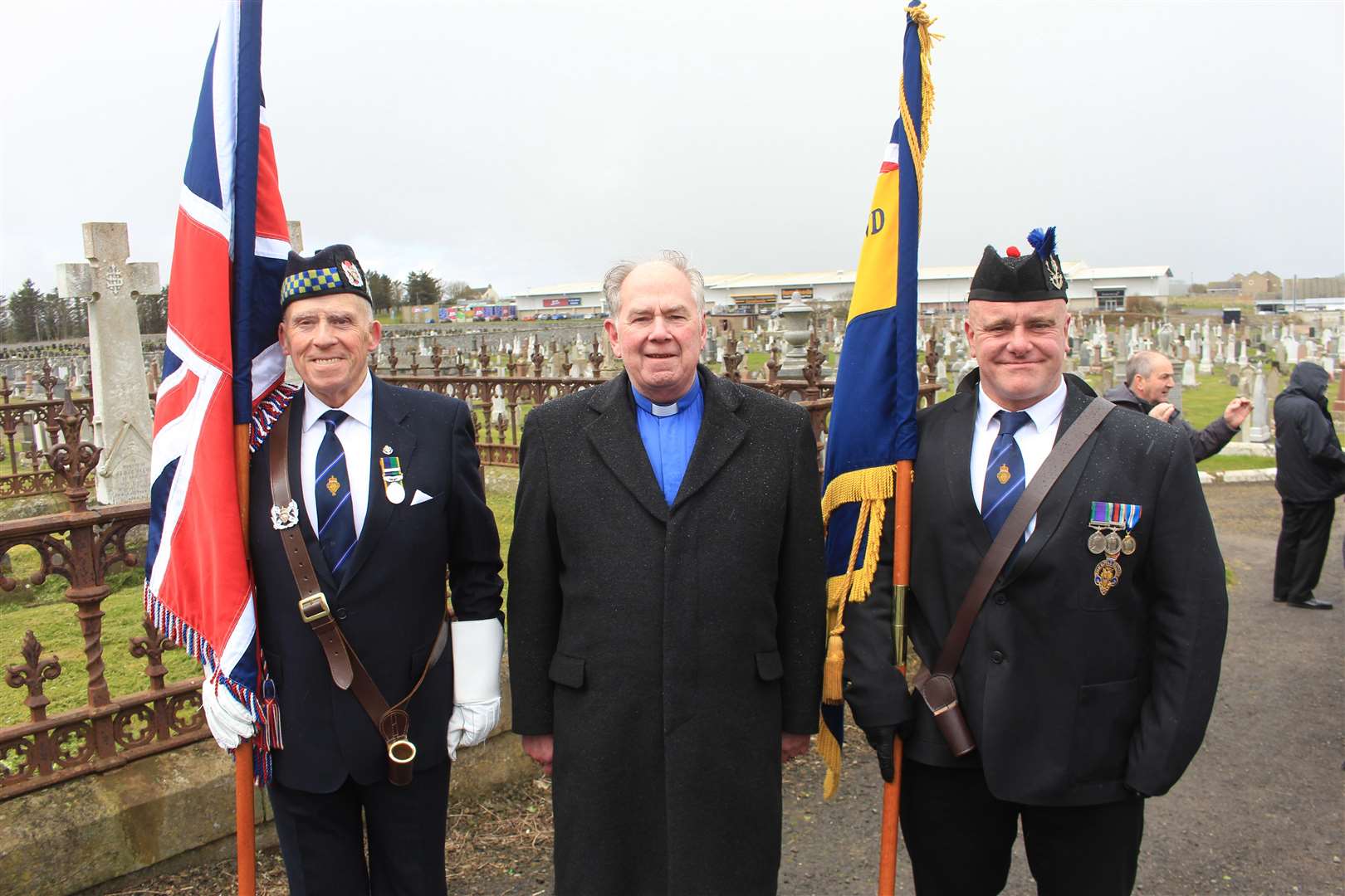 The Rev Lyall Rennie with the Legion branch colour party, Alex Paterson (left) and Kev Stewart. Picture: Alan Hendry
