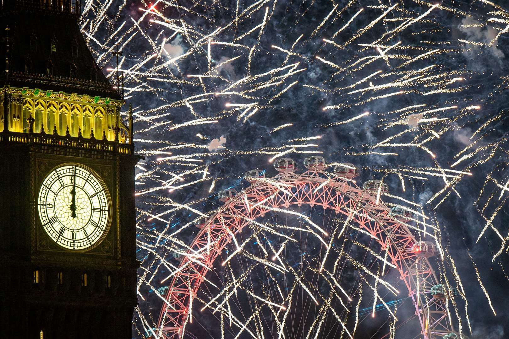 Fireworks light up the sky over the London Eye (Aaron Chown/PA)