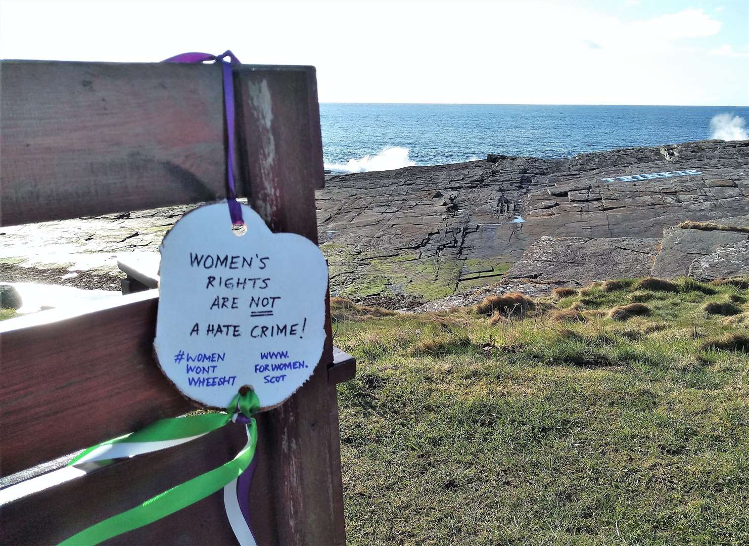 Women's rights medallion with ribbons set up at the Trinkie recently which also has the same message Trina drew out #WomenWontWheest. Another was also spotted near Reiss beach.