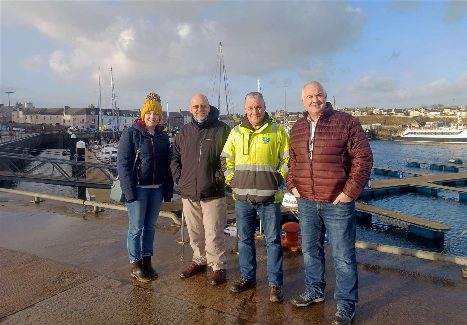 Wick Harbour Authority chairman Robert Silverwood (second from left) and harbour master Ian Cormack following a meeting with Nicola More of Focus North and Councillor Raymond Bremner (right), chairman of the Focus North advisory board, after the storm damage at the end of last year.