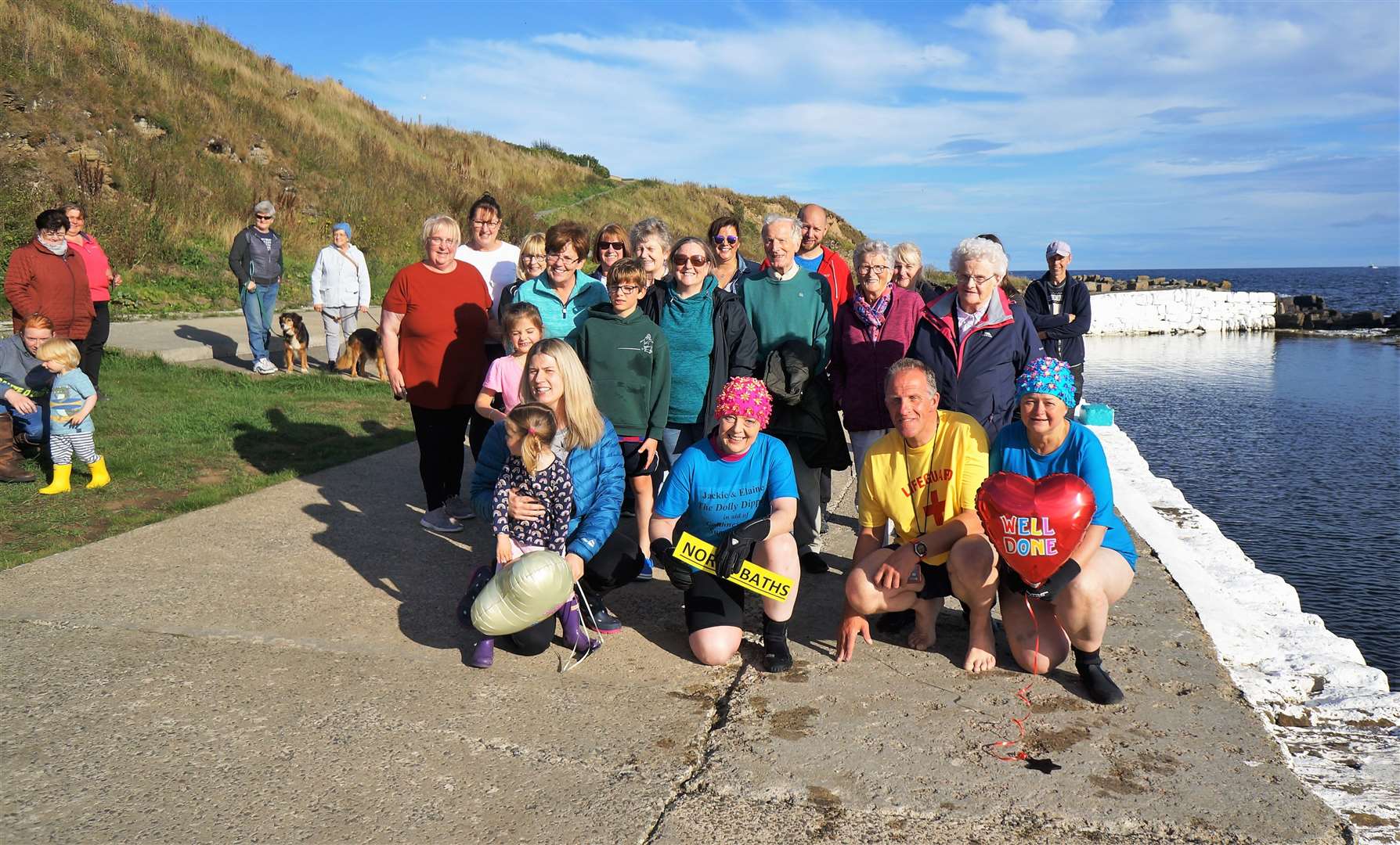 Dolly Dippers with their supporters at the end of their fundraising wild swimming expedition around the Caithness coast on Saturday. Pictures: DGS