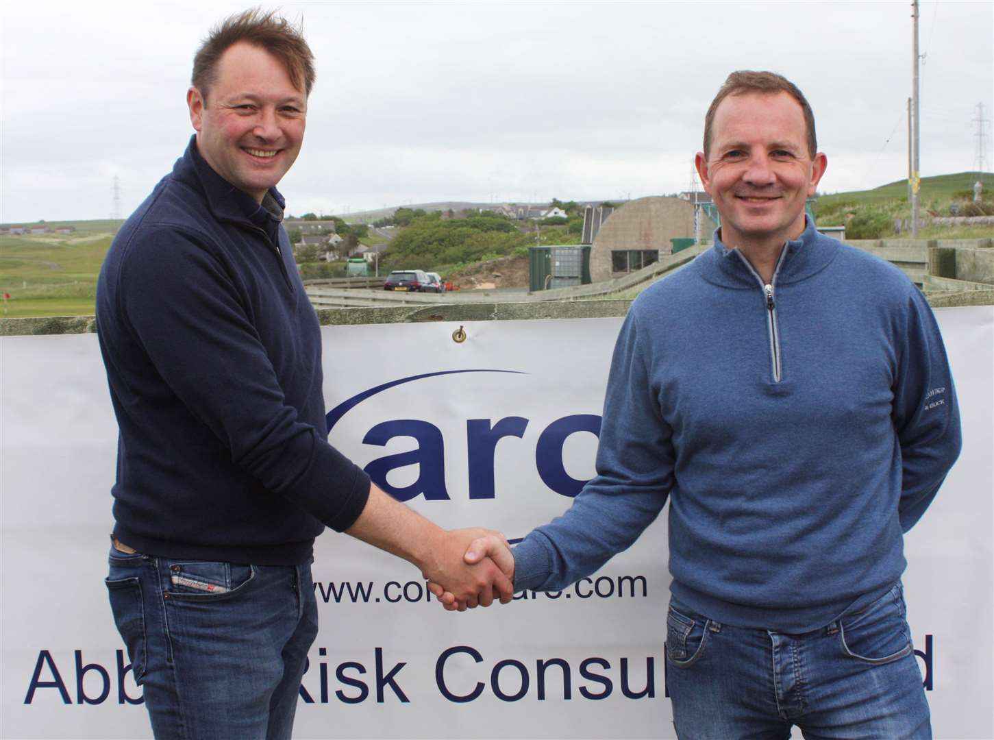 Colin Paterson (left) is congratulated by match secretary Andy Bain following his victory in Reay's Rotary Open, which was sponsored by Abbott Risk Consulting.