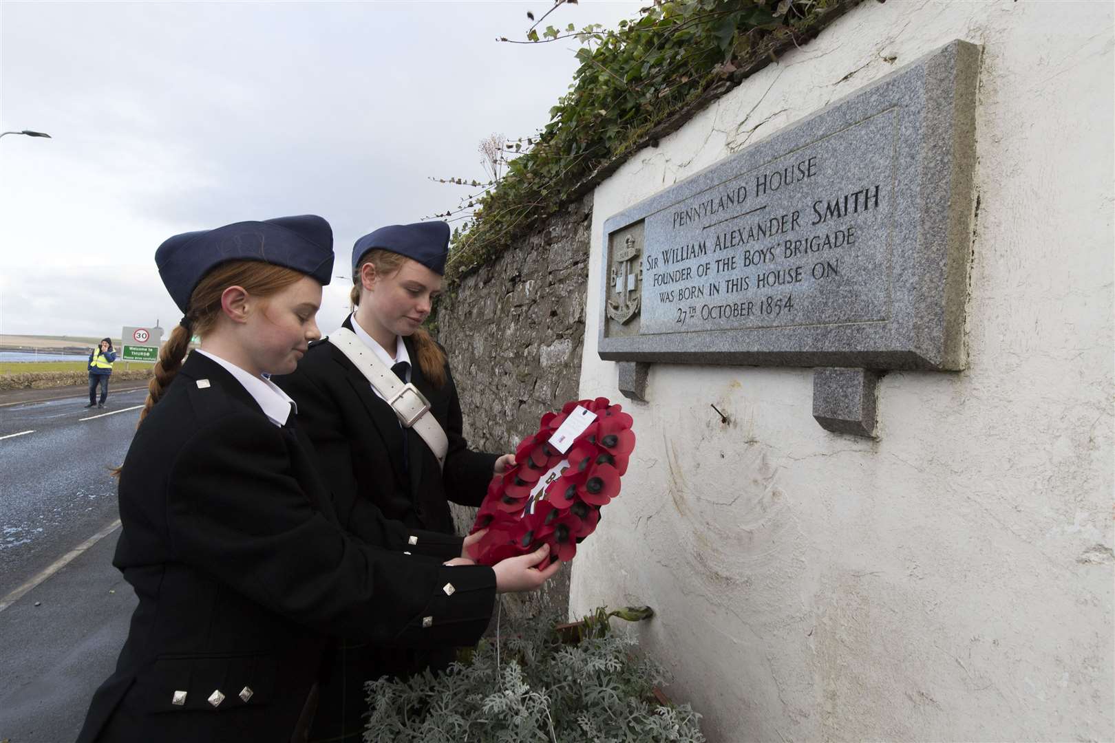 Sisters Clara and Jessica Tickle of the 5th Croydon Company of the Boys Brigade lay a wreath on the memorial for Sir William Alexander Smith, at Pennyland House where he was born. Photos: Robert MacDonald/Northern Studios