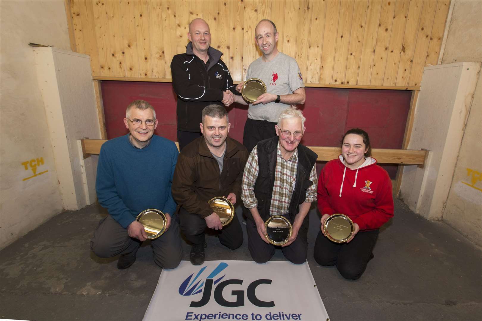 Halkirk Rifle Club held its annual JGC-sponsored open shoot on Tuesday evening. Halkirk shooter Robbie Campbell (back, right) won class X, keeping the main trophy in the club and the family, as he received his cup from his brother John, making the presentation on behalf of JGC Engineering and Technical Services. Winners of classes A to D were (from left) Rogni Brown, Pentland; Gordy Levack, Halkirk; James Manson and Caitlin Green, both Westfield. Picture: Robert MacDonald / Northern Studios