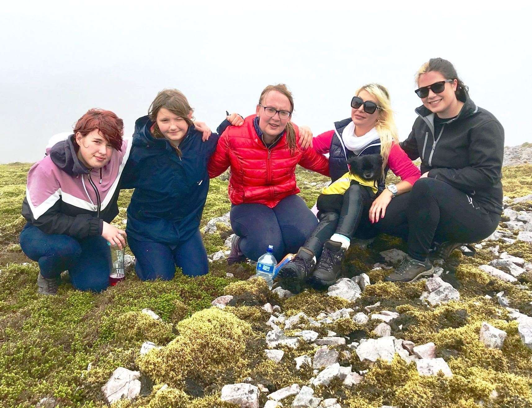 Horsin' Around team members at the top of Scaraben. From left: Sophie Bell, Gina Lewis, Eleanor Hargrave, Natalie Oag with club mascot Louis Vuitton and Sophie Morgan. Picture: Alister Mather