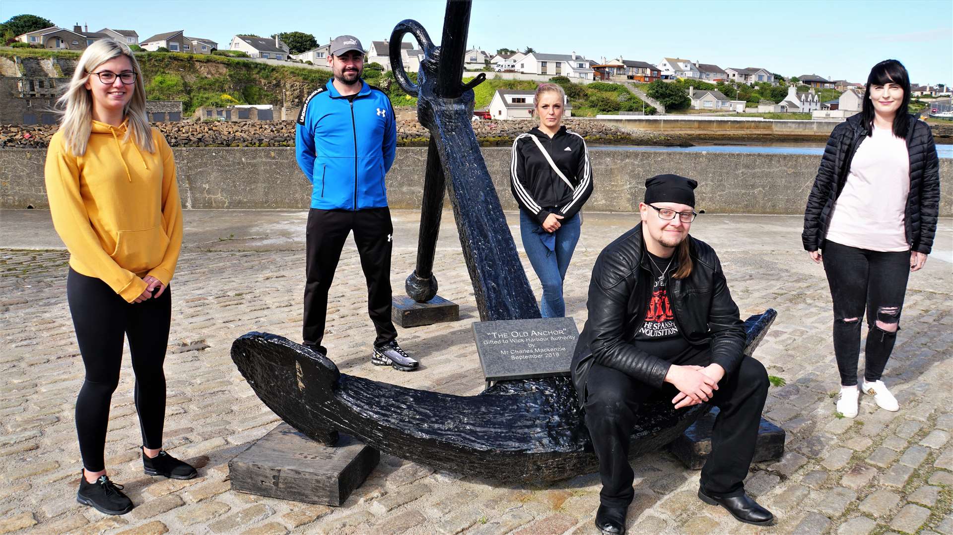 Core members of the Facebook group No More Lost Souls (standing, from left) Jade Sinclair, Ricky Ross, Natasha Kelly and Gemma Fraser with Steven Szyfelbain (seated). The anchor is a symbol used on the group's Facebook page. Picture: DGS