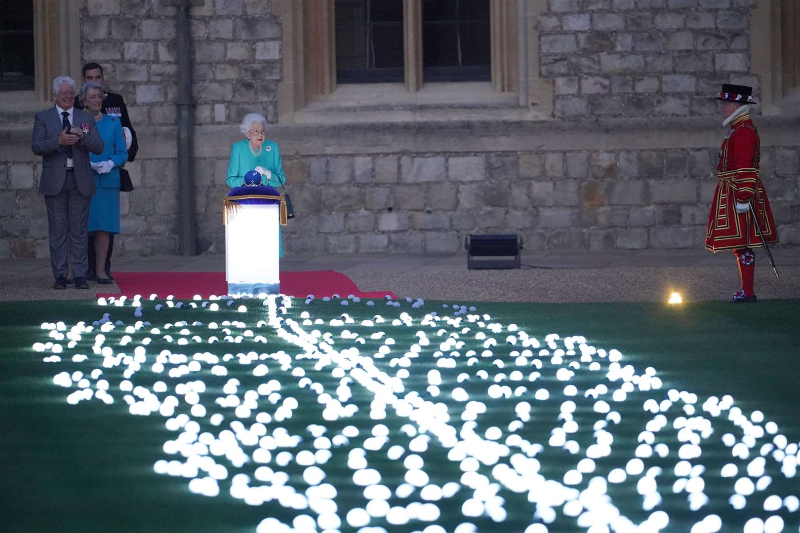 The Queen symbolically leads the lighting of the principal Jubilee beacon at Windsor Castle (Jonathan Brady/PA)