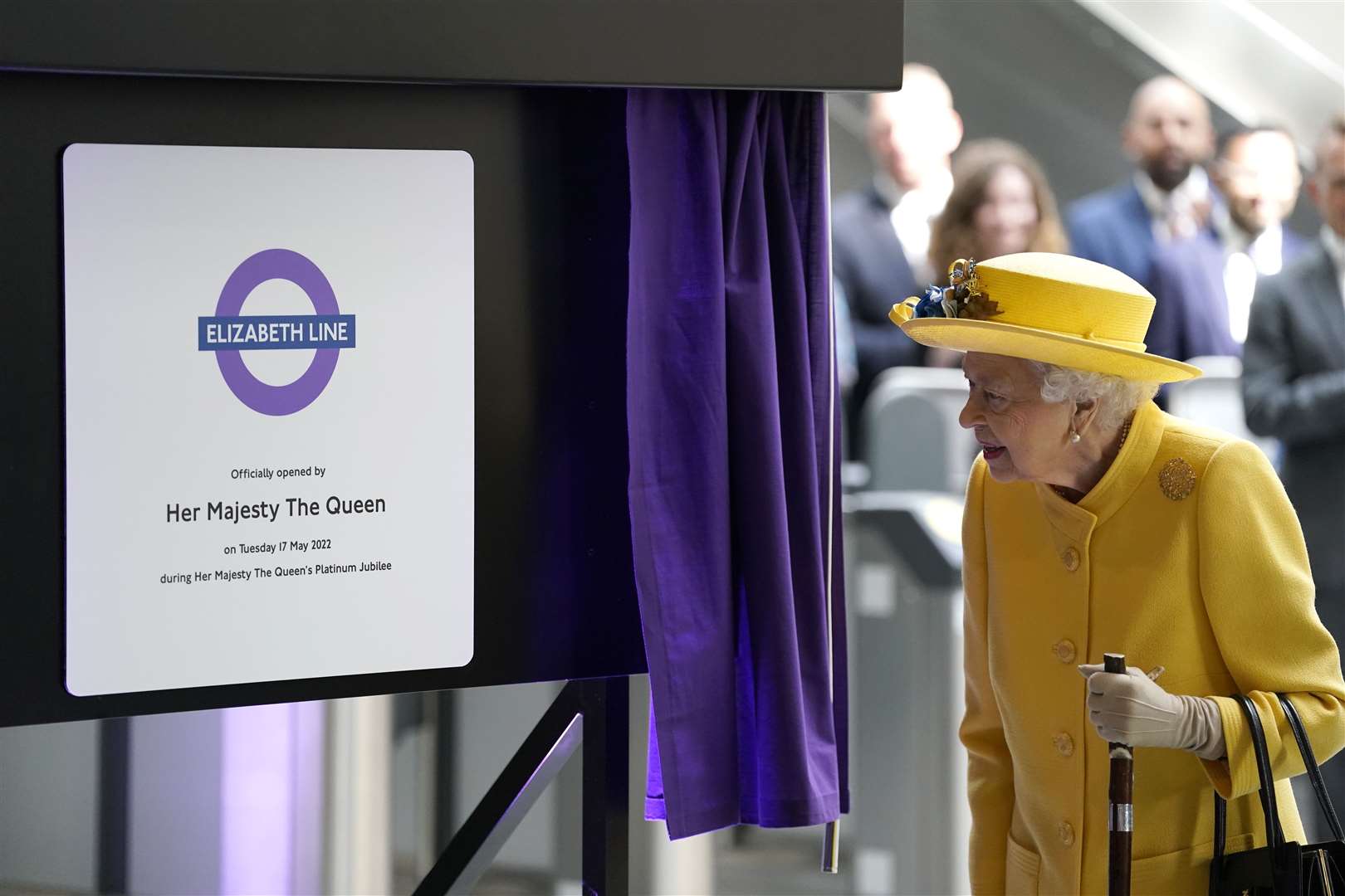 The Queen unveils a plaque to mark the Elizabeth line’s official opening at Paddington station (Andrew Matthews/PA)