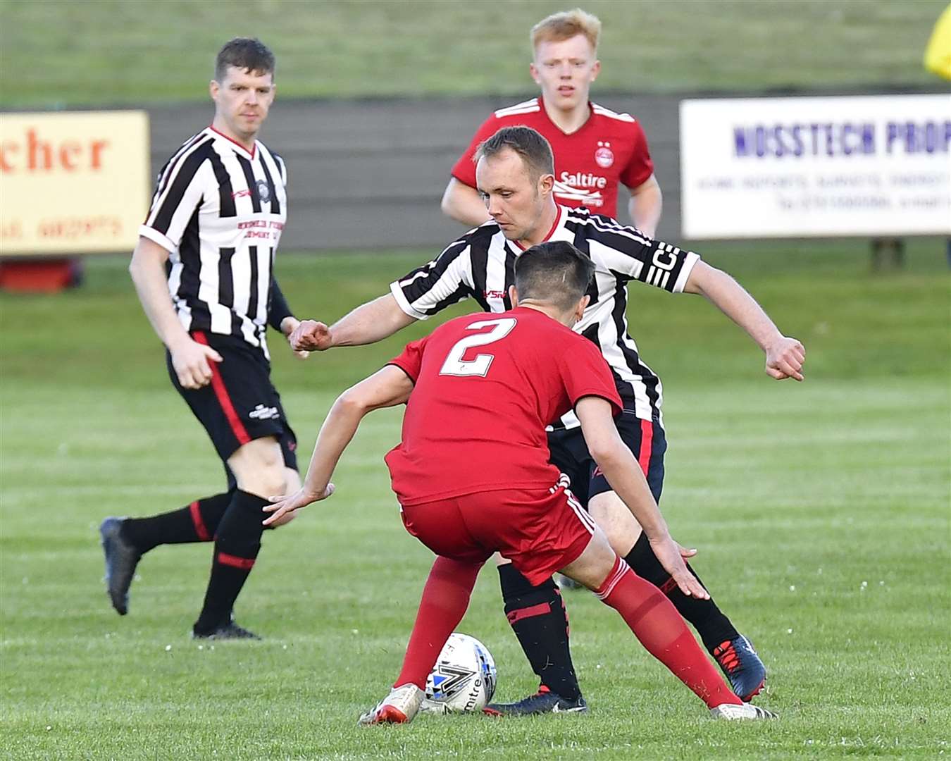 Richard Macadie takes on Aberdeen's Calvin Ramsay during the testimonial match at Harmsworth Park on Tuesday. Picture: Mel Roger