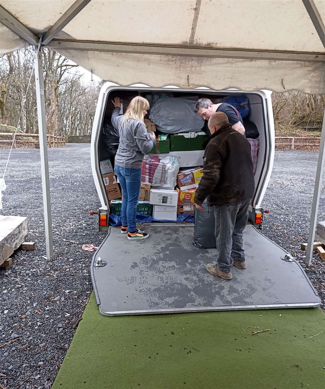 Ailsa MacLeod loading a van with Johnny Mackenzie (foreground) and Andy MacLeod.