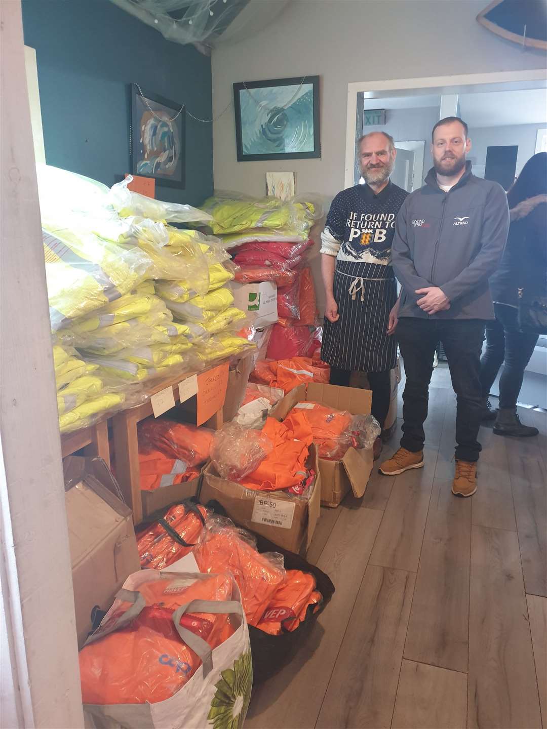 Thurso Community Café volunteer Andy Gearie (left) and scaffold foreman Billy Brock are pictured along with some of the personal protective equipment donated from the Aberdeen business unit of Altrad Services.