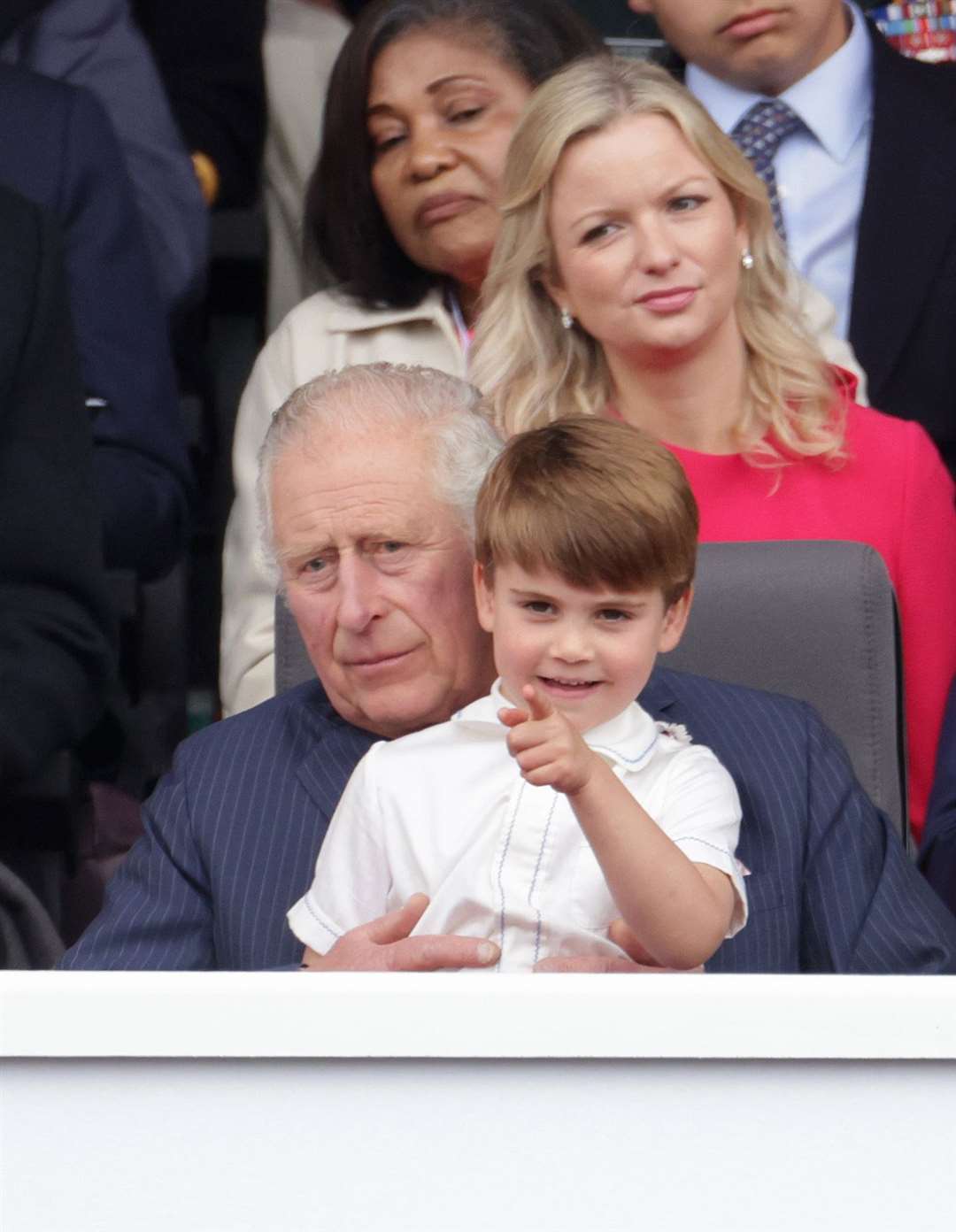 Prince Louis sits on his grandpa’s lap (Chris Jackson/PA)