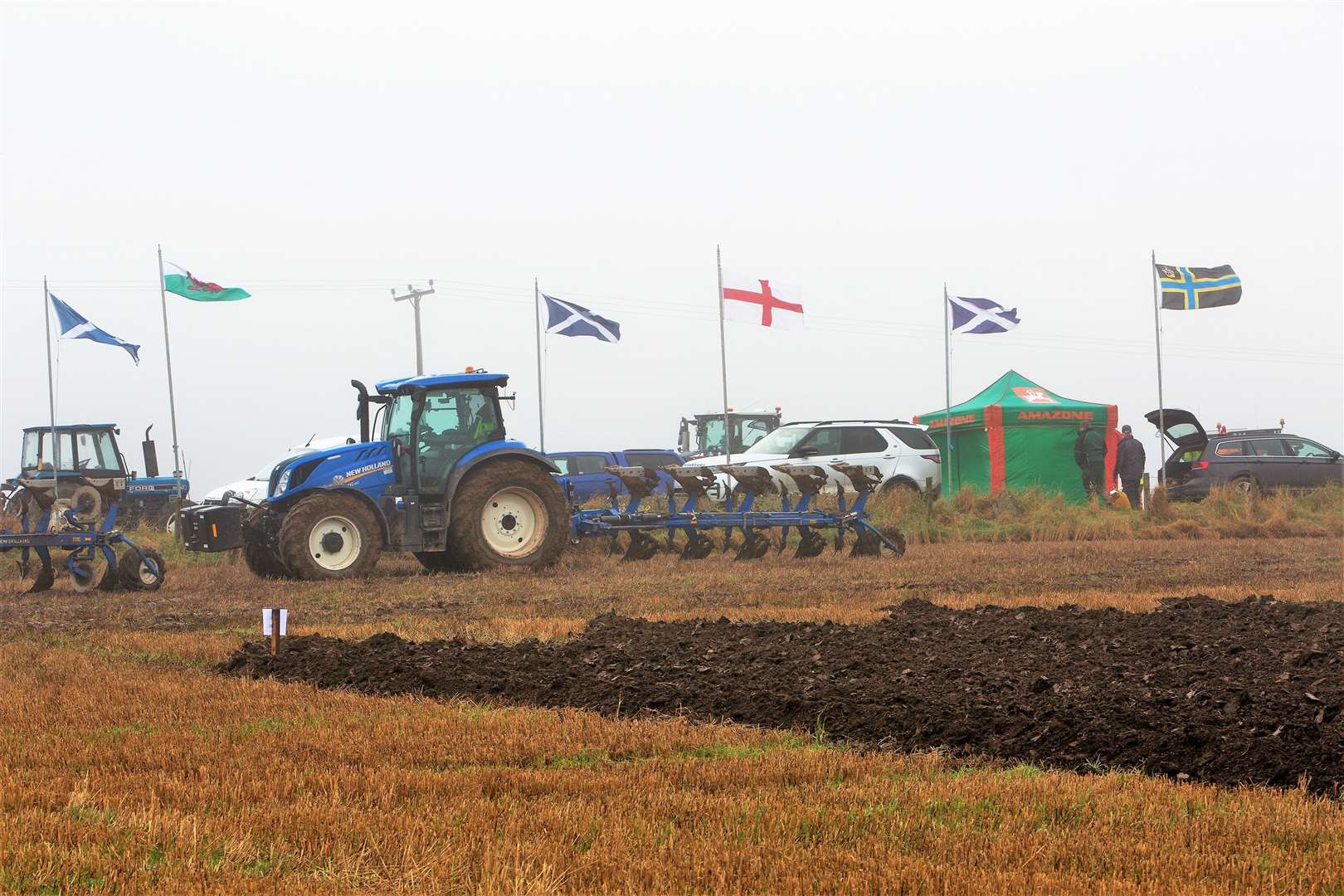 The national flags, along with the Caithness flag, flutter in the breeze. Photo: Robert MacDonald/Northern Studios