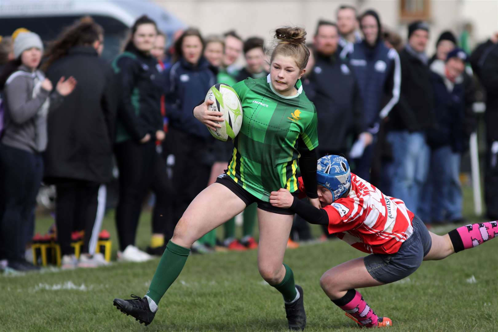 Hannah Dunnett of Caithness Girls U15 team shrugs off this challenge to score one of her five tries against Grampian at Millbank. Picture: James Gunn