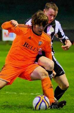 Gary Manson seen here trying to dispossess Rothes defender Greig Watson.