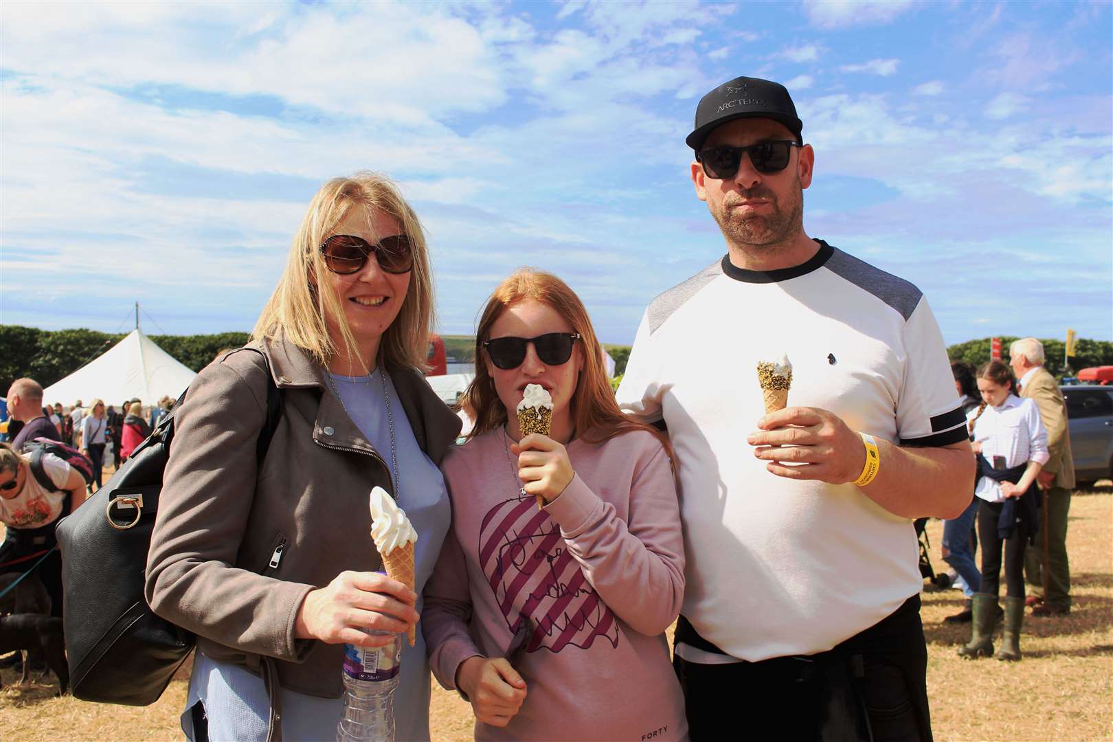 The Cowie family from Helmsdale cooling down with ice-cream cones at the Thurso East show field. Picture: Alan Hendry